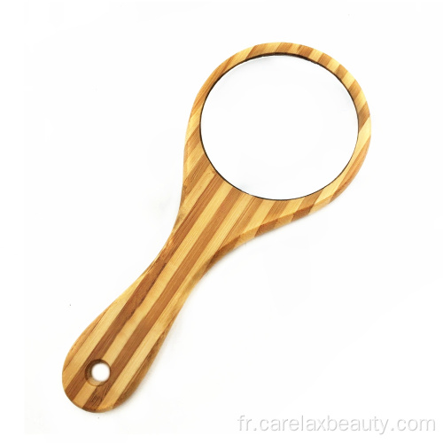 Miroir bambou à main dans un cadre rond en bois